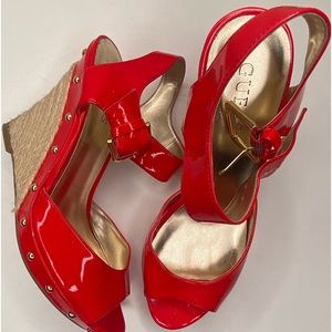 Red GUESS shiny faux leather wedges. Size 8 ½.